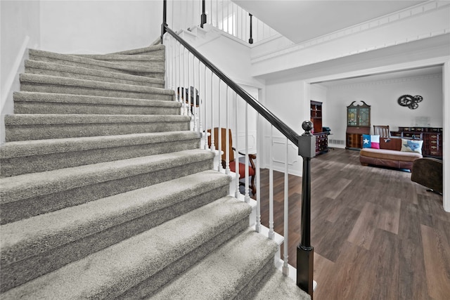 stairs with hardwood / wood-style floors