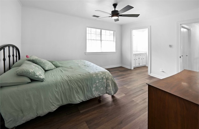 bedroom with ensuite bath, dark hardwood / wood-style flooring, and ceiling fan