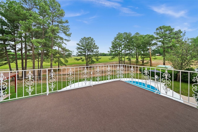 view of patio featuring a balcony