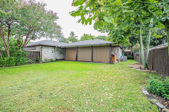 view of yard featuring central AC