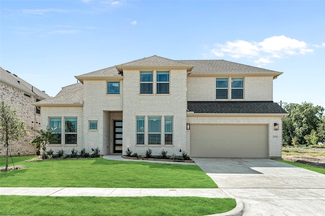 prairie-style house with a front yard and a garage