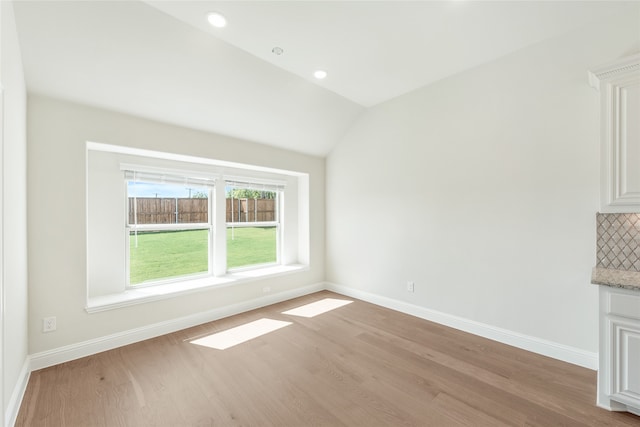 interior space featuring vaulted ceiling and light wood-type flooring