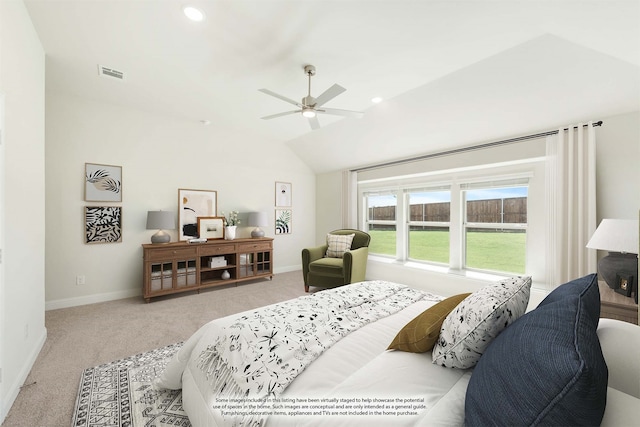 carpeted bedroom with vaulted ceiling and ceiling fan