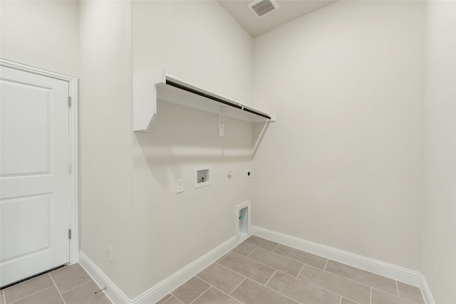 clothes washing area with electric dryer hookup, gas dryer hookup, washer hookup, and light tile patterned floors