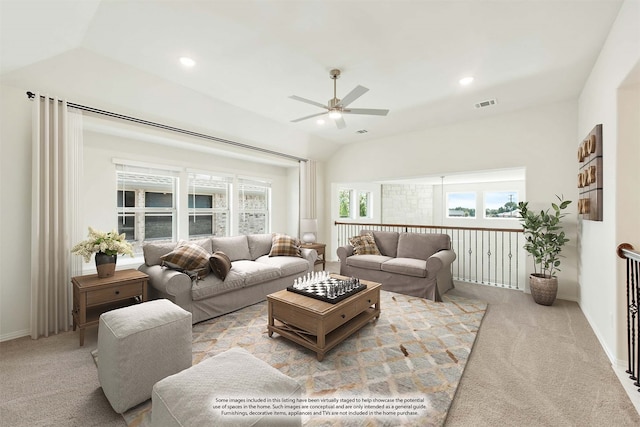 living room featuring lofted ceiling, light carpet, and ceiling fan