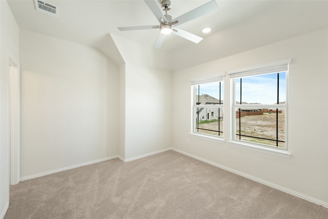 bonus room with light colored carpet and ceiling fan