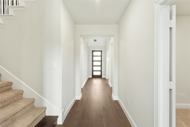 hall featuring dark wood-type flooring