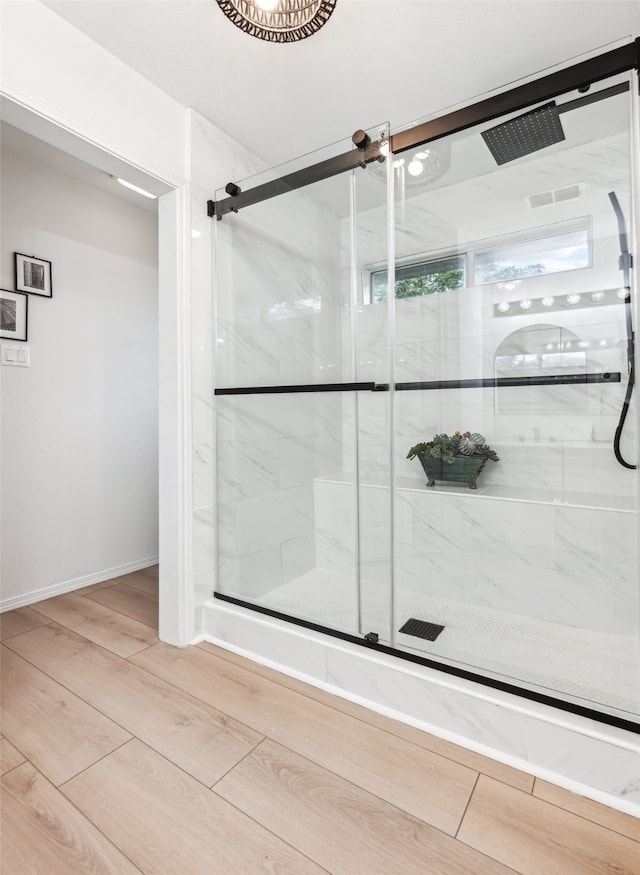 bathroom with an enclosed shower