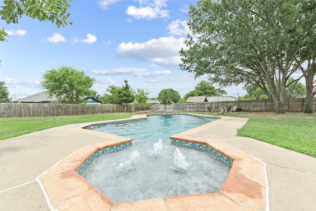 view of pool with a jacuzzi, pool water feature, and a yard