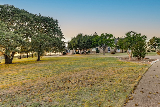 view of yard at dusk