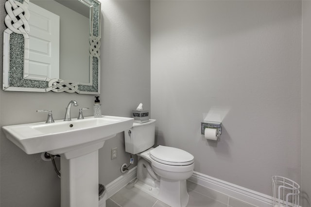 bathroom featuring toilet and tile patterned floors