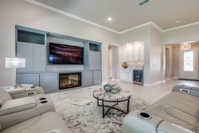 living room featuring crown molding, light tile patterned floors, and beverage cooler