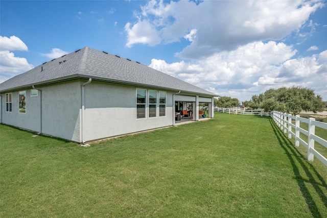 10008 Baywood Ct, Denton, TX 76207 - rear view of property featuring a shingled roof, stucco siding, and a patio area