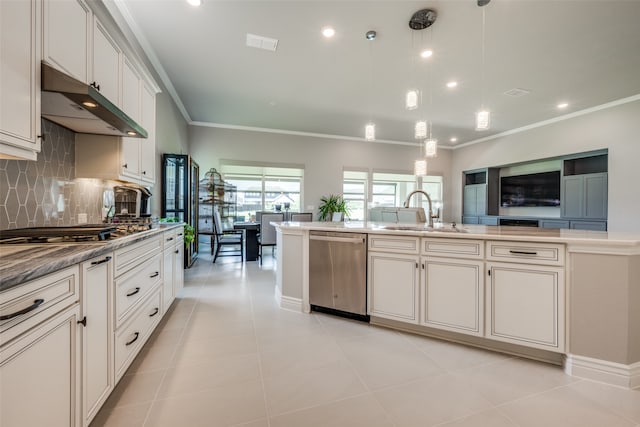 kitchen featuring sink, appliances with stainless steel finishes, light tile patterned floors, backsplash, and pendant lighting