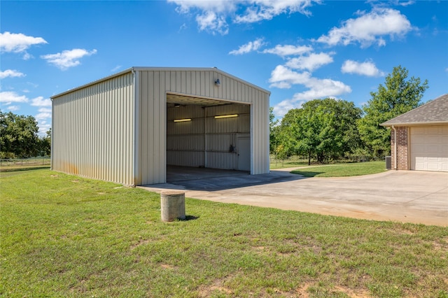 garage featuring a lawn