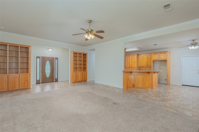 unfurnished living room with crown molding, ceiling fan, and light carpet