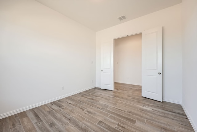 unfurnished bedroom with light hardwood / wood-style floors