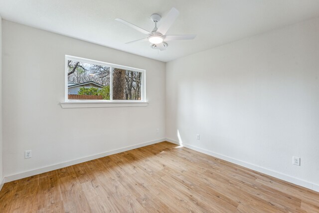 unfurnished room featuring light hardwood / wood-style flooring and ceiling fan