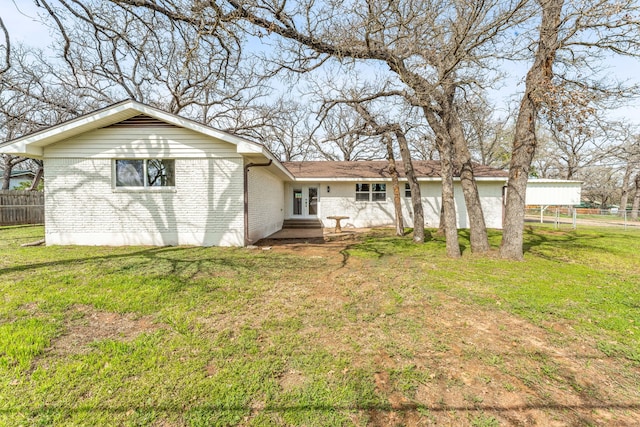 back of house with a yard