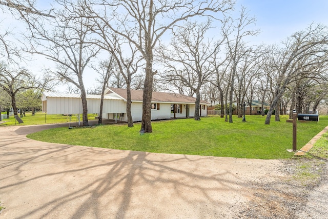 ranch-style house with a front lawn