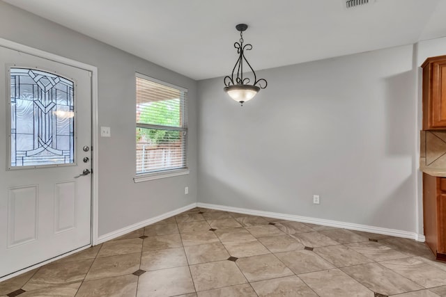 entryway with light tile patterned floors