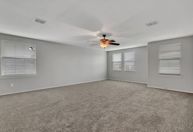 unfurnished room with carpet flooring and ceiling fan