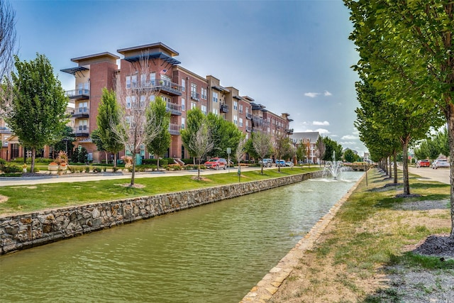 view of community with a water view