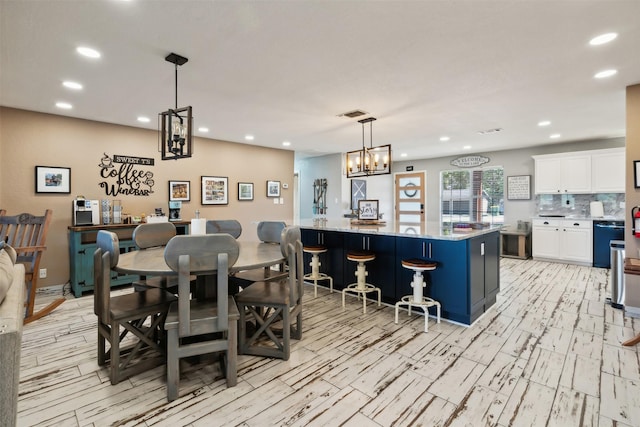 dining space with visible vents and recessed lighting