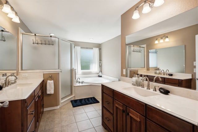 bathroom featuring tile patterned floors, independent shower and bath, and vanity