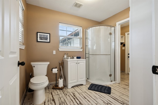 bathroom with vanity, toilet, and curtained shower