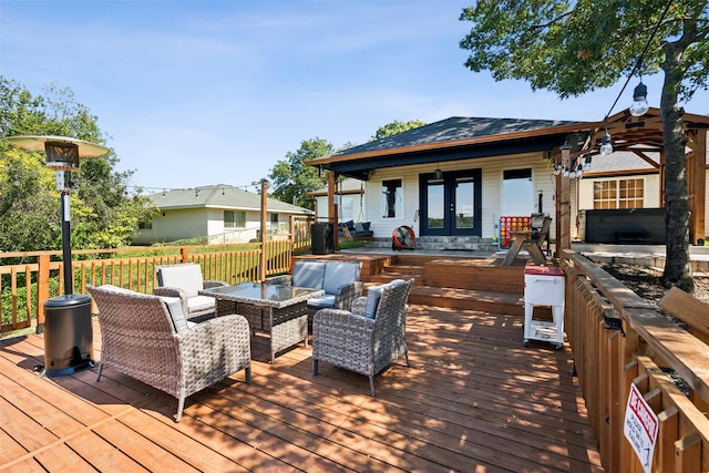 wooden deck featuring outdoor lounge area and french doors