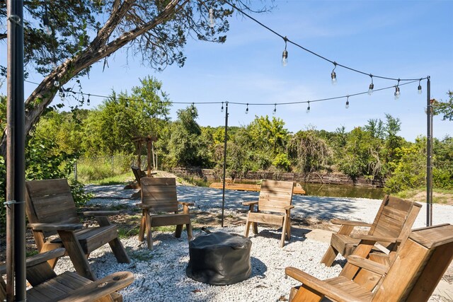 view of patio featuring a water view