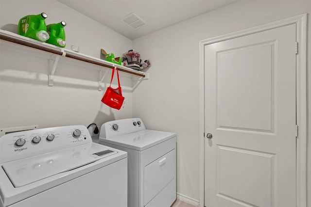 laundry room with washer and dryer