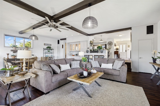 living room featuring beamed ceiling, ceiling fan, and dark hardwood / wood-style floors