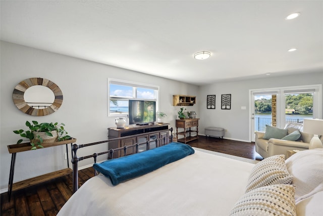 bedroom featuring dark hardwood / wood-style floors and access to exterior