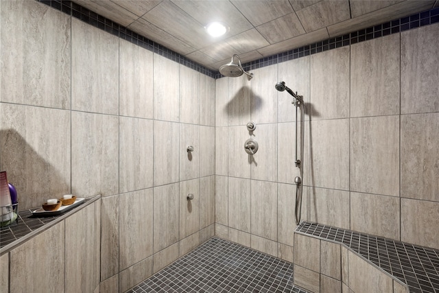 bathroom featuring a tile shower