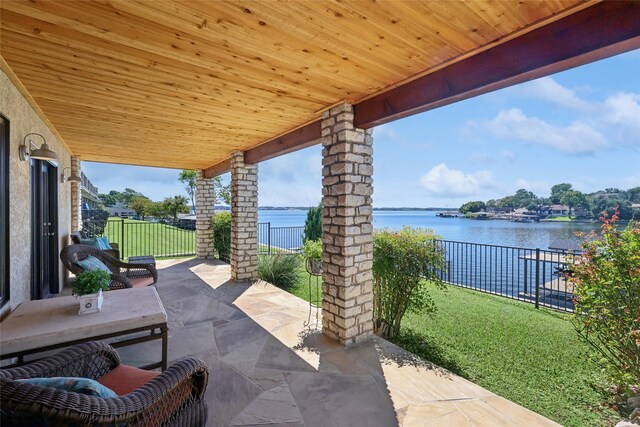 view of patio featuring a water view