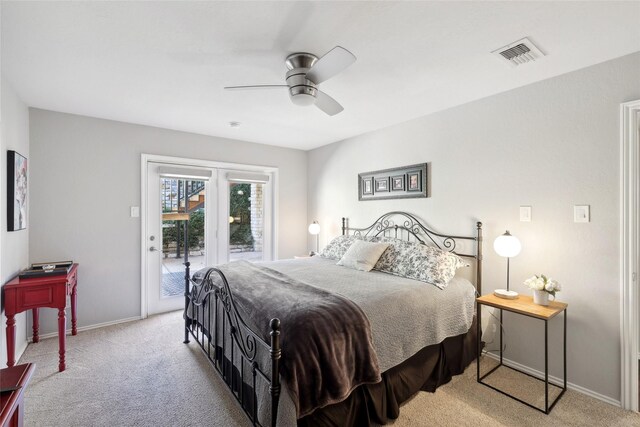 bedroom featuring ceiling fan, light colored carpet, and access to exterior