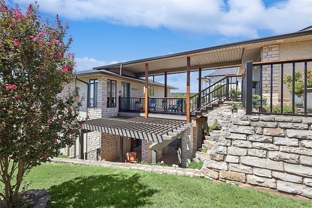 rear view of property featuring a deck