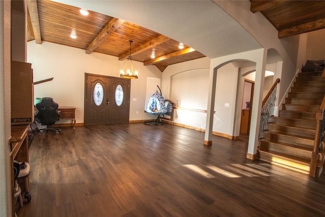 entryway featuring wooden ceiling, dark wood-type flooring, lofted ceiling with beams, and a notable chandelier