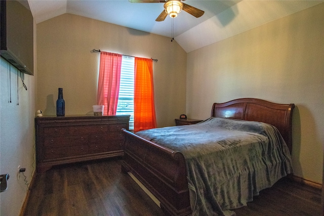 bedroom featuring ceiling fan, vaulted ceiling, and dark hardwood / wood-style flooring