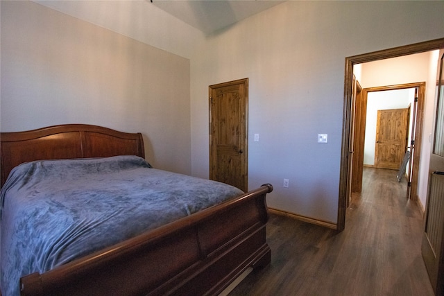 bedroom featuring dark wood-type flooring