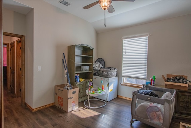 playroom featuring lofted ceiling, dark wood-type flooring, and ceiling fan