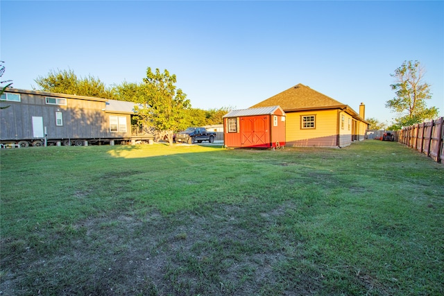 view of yard with a storage shed