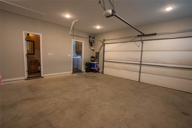 garage featuring washer / dryer and a garage door opener