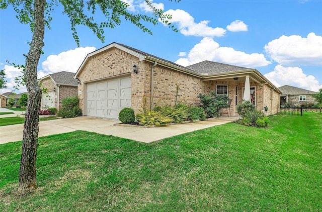 view of front of property with a front lawn and a garage