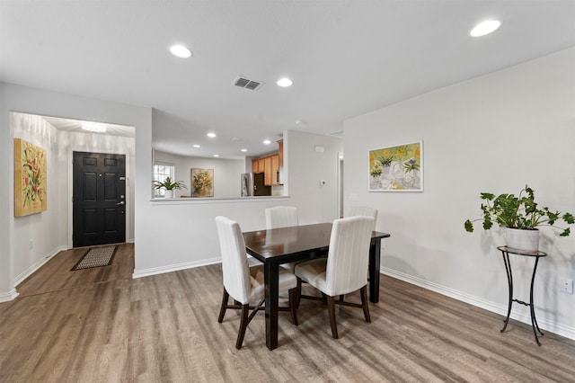 dining space featuring light hardwood / wood-style floors