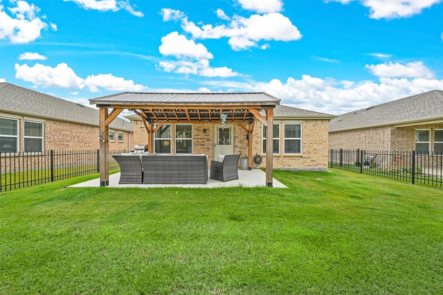 back of house featuring a patio area, a yard, and outdoor lounge area