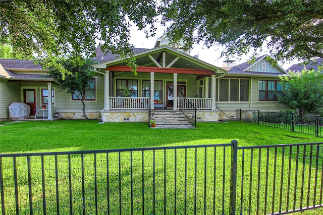 view of front of house with a front yard and a porch