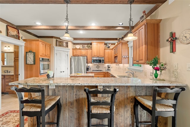 kitchen with decorative light fixtures, tasteful backsplash, stainless steel appliances, kitchen peninsula, and light stone counters